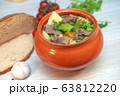 Roast in a pot with beef meat and potatoes on the table 63812220