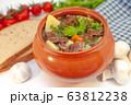 Roast in a pot with beef meat and potatoes on the table 63812238