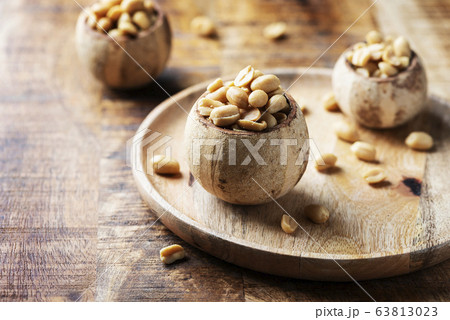 Salt peanut on the wooden table 63813023