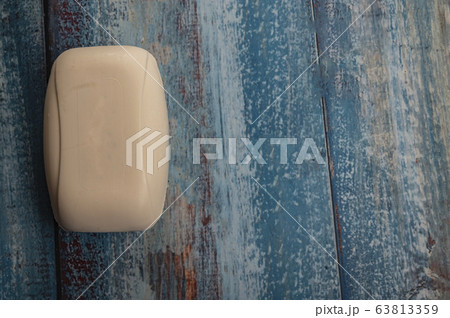 A piece of toilet soap on a wooden background. A piece of toilet soap on a wooden background. 63813359
