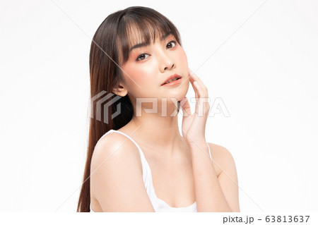 Young Beautiful Asian woman smile touching soft cheek  63813637