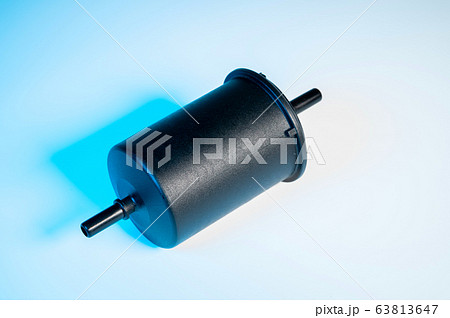 New fuel filter in a black plastic housing for diesel and gasoline engines on a gray background New fuel filter in a black plastic housing for diesel and gasoline engines on a gray background 63813647