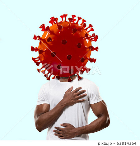 Man headed by model of COVID-19 coronavirus, concept of pandemic spreading 63814364