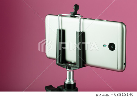 Smartphone on a tripod as a photo-video camera on Smartphone on a tripod as a photo-video camera on 63815140