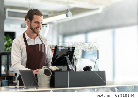 Male Barista working. Male Barista working. 63818144