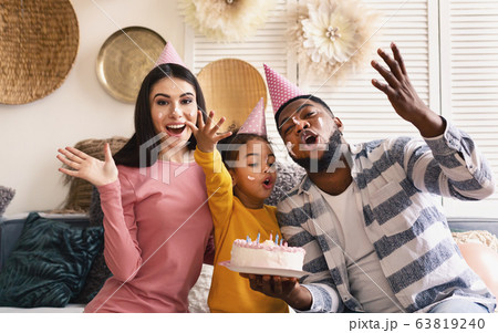 International family in caps smeared in cake 63819240