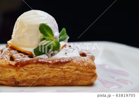 Cake with ice cream on plate. Cake with ice cream on plate. 63819705