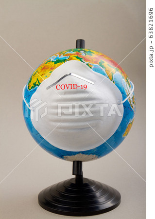 World globe wearing protective mask to protect from coronavirus. 63821696