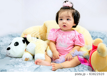 cute baby girl in a pink dress 63822020