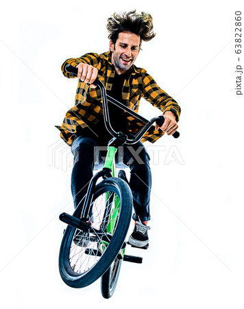 BMX rider cyclist cycling freestyle acrobatic stunt isolated white background BMX rider cyclist cycling freestyle acrobatic stunt isolated white background 63822860