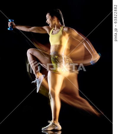 woman exercising fitness exercises isolated black background lightpainting effect 63822882