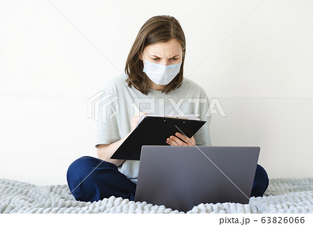 Coronavirus. Quarantine. Girl and distance learning. Studying online. Coronavirus. Quarantine. Girl and distance learning. Studying online. 63826066