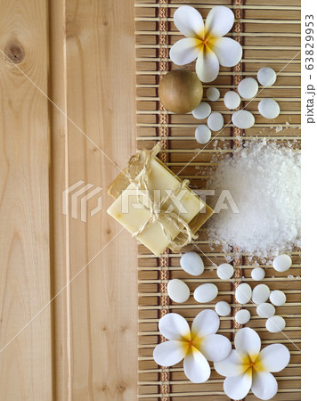 Soap,wooden ball,stones and tiare flowers on the Soap,wooden ball,stones and tiare flowers on the 63829953