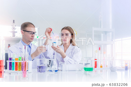 Scientists researching for some confidential in chemical laboratory Scientists researching for some confidential in chemical laboratory 63832206