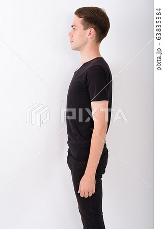 Young handsome man against white background Young handsome man against white background 63835384