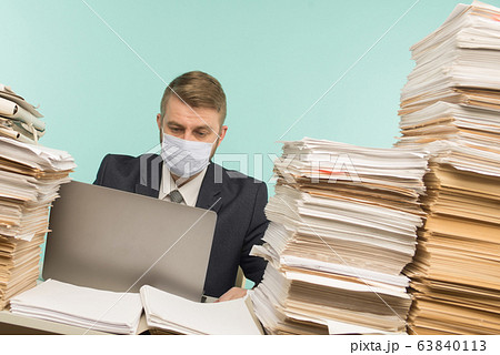A male accountant or company manager works in an A male accountant or company manager works in an 63840113