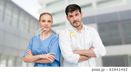 Doctors at hospital working with another doctor. Doctors at hospital working with another doctor. 63841492