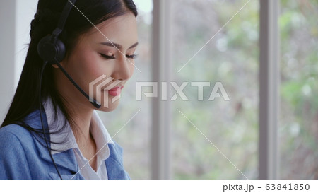 Customer support agent or call center with headset 63841850
