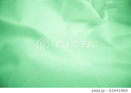 Shiny flowing cloth texture in macro shot. 63841960