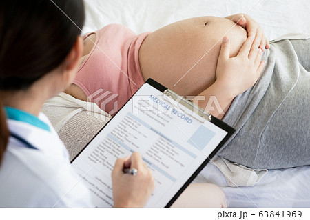 Pregnant Woman and Gynecologist Doctor at Hospital Pregnant Woman and Gynecologist Doctor at Hospital 63841969
