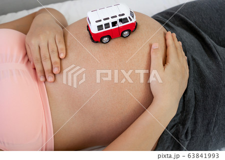 Happy pregnant woman and expecting baby at home. Happy pregnant woman and expecting baby at home. 63841993