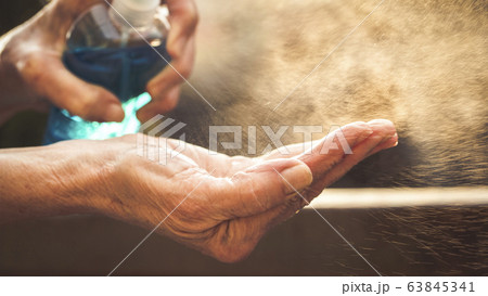 spraying hand sanitizer coronavirus prevention spraying hand sanitizer coronavirus prevention 63845341