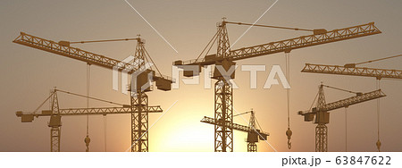 Construction cranes at sunset 63847622