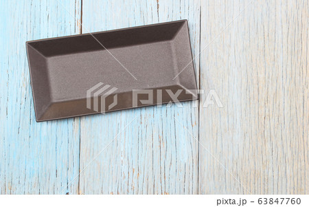 plate on wood table background 63847760