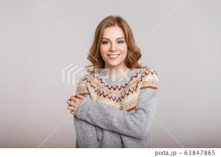 Portrait of a happy beautiful woman in a sweater Portrait of a happy beautiful woman in a sweater 63847865