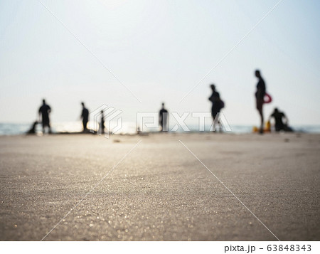 Silhouette People Family on beach sunlight Holiday background Silhouette People Family on beach sunlight Holiday background 63848343