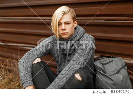 Handsome young man with hairstyle Handsome young man with hairstyle 63849176