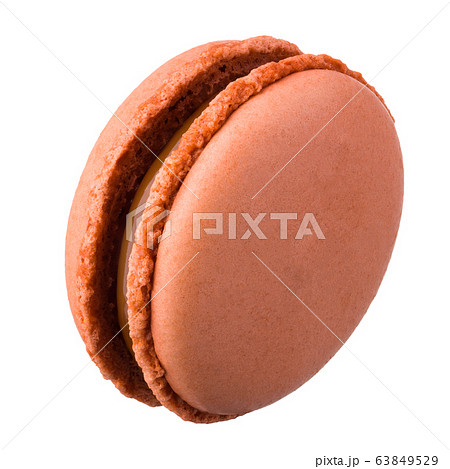 Macro photo of french caramel macaroon or macaron Macro photo of french caramel macaroon or macaron 63849529