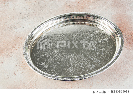 Antique silver plated tray on concrete background. 63849943