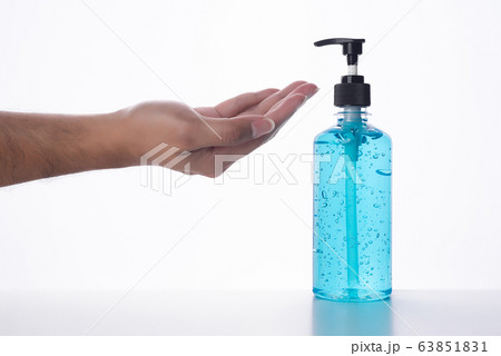 Hand of man that applying alcohol gel to make cleaning and clear germ, 63851831