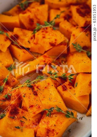 Roasted pumpkin slices with thyme 63851953