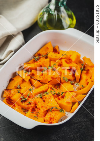Roasted pumpkin slices with thyme 63851955