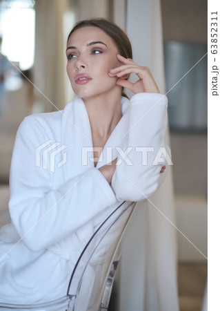 woman resting in a bathrobe at home woman resting in a bathrobe at home 63852311