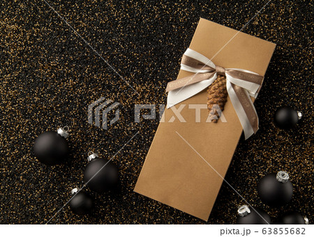 booklet with a christmas tree toy on the sand booklet with a christmas tree toy on the sand 63855682