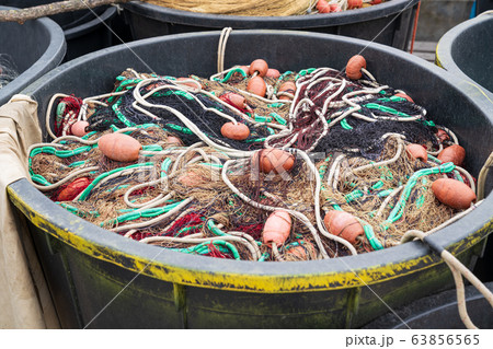 Fishing nets inside huge plastic bin Fishing nets inside huge plastic bin 63856565