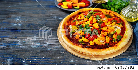 Vegan pizza with vegetables, tomato pesto and 63857892