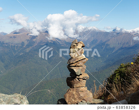 Stone pyramid on a background of a mountain range Stone pyramid on a background of a mountain range 63858326