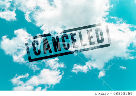 Coronavirus, covid 19 concept. Sky in the clouds and the inscription Flights canceled Coronavirus, covid 19 concept. Sky in the clouds and the inscription Flights canceled 63858569