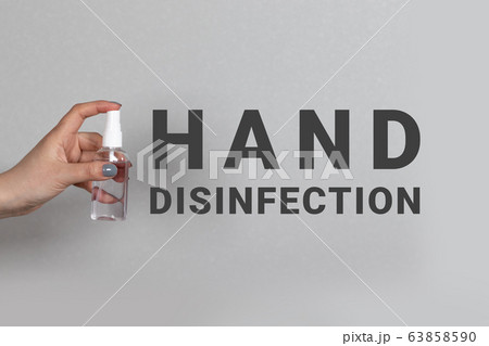 Person uses or hand disinfection with alcohol spray clean disinfectant for bacteria viruses dirty skin care. Covid-19 63858590