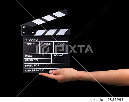 Human hand holding film clapper board isolated on 63859934