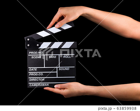 Human hand holding film clapper board isolated on Human hand holding film clapper board isolated on 63859938