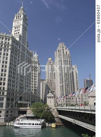 Wrigley and Tribune Buildings on Chicago River with cruise boat on the foreground, USA Wrigley and Tribune Buildings on Chicago River with cruise boat on the foreground, USA 63860437