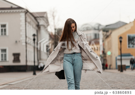 Trendy brown-haired young woman 63860893