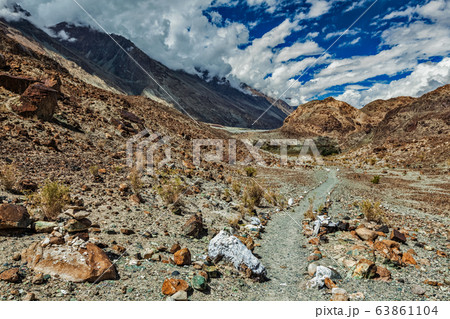 Foot path to sacred Buddhist lake Lohat Tso in Himalayas. Nubra valley, Ladakh, India Foot path to sacred Buddhist lake Lohat Tso in Himalayas. Nubra valley, Ladakh, India 63861104