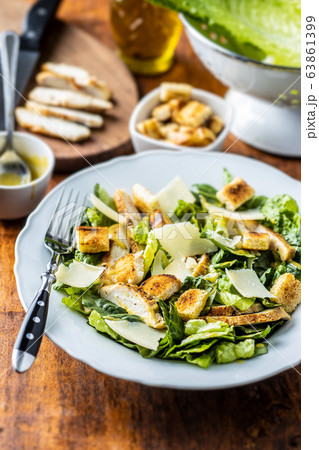 Chicken Caesar Salad with Cheese and Croutons 63861399