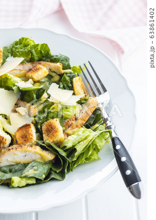 Chicken Caesar Salad with Cheese and Croutons 63861402